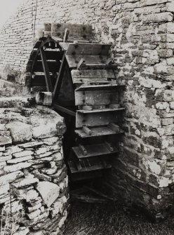 View of water wheel against N gable.