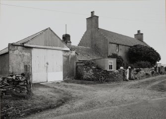 View of house and shed from SW.