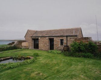 View of garden outbuilding from W