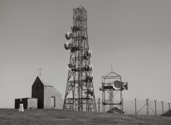 View of telecommunications mast and dovecot from W