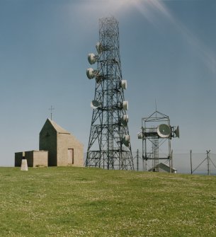 View of telecommunications mast and dovecot from W