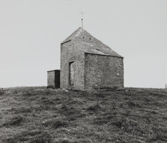 View of dovecot (or doocot) from NE, with water storage tanks in front