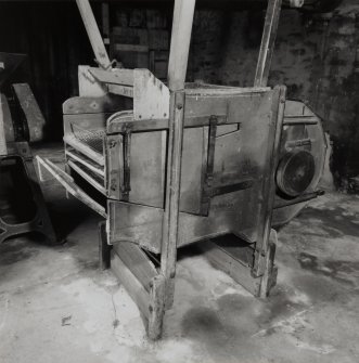 View of grain dresser located on ground floor of the threshing barn