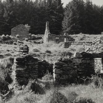 Arichonan Township.
View of upper part of site from South East, showing gable of B2 and two storried house with D2 in foreground.