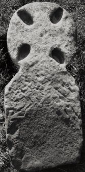 Photograph of disc-headed gravemarker (15) removed from ground (rear side).