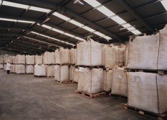 View from E in Weed Store, showing sacks of milled weed awaiting processing into alginate