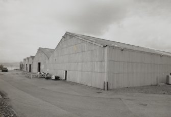 View from SSW of SW end of works, containing weed stores (left), and settling tanks (right)