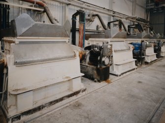 View from SW of part of a row of nine Dough Mixers, manufactured by the Morton Machine Co Ltd of Wishaw, Scotland. In this process, the Alginic Acid is mixed with Sodium Carbonate to produce Sodium Alginate Dough in 400 kg batches