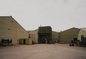 View from SE of NE end of main production block, including tower-mounted cast-iron water tank