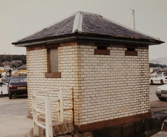 View from SE of former urinal building, known locally as the 'white elephant', and now disused.  Photosurvey 9-OCT-1991