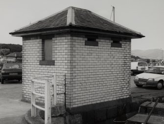 View from SE of former urinal building, known locally as the 'white elephant', and now disused.  Photosurvey 9-OCT-1991