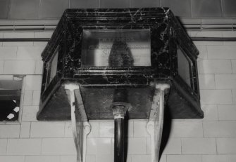 Detail of glass-sided cistern, one of three above the wall-mounted urinal stalls.  Photosurvey 9-OCT-1991