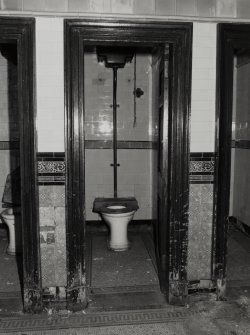 General view of toilet cubicle (one of nine) from E, showing tiles and mosaic floor.  Photosurvey 9-OCT-1991