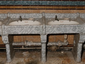 View of sinks (two of four), with grey 'marble' surround, created by a glaze on a clay base.   Photosurvey 9-OCT-1991