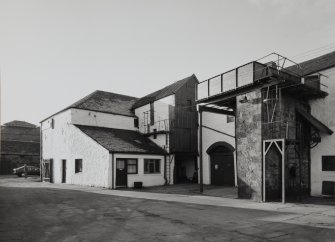 View from N of main production block of distillery, including Still House, Mash House, Mill House and Tun Room