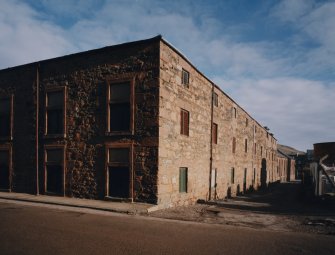 View from SW along SE side of distillery (Well Close), with floor-Maltings in foreground, and Malt Store in background
