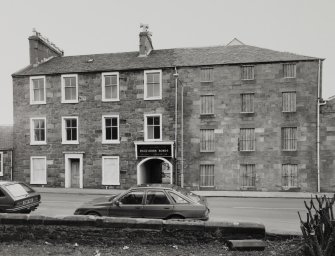 Campbeltown, Millknowe Road, Hazelburn Distillery.
General view of central part of facade from South-West, showing dwelling house, entrance to distillery and former maltings/granaries.