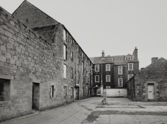 Campbeltown, Millknowe Road, Hazelburn Distillery.
View of yard to maltings/granaries, dwelling house and offices from North-East.