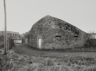 Campbeltown, Millknowe Road, Hazelburn Distillery.
General view of North-East curved end of duty free warehouse (at North-East corner of distillery) from North-East.