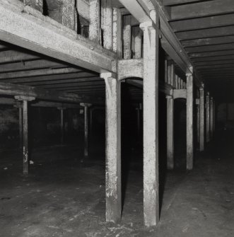 Campbeltown, Millknowe Road, Hazelburn Distillery, interior.
View of double cast iron square section columns (single casting) dividing central and North-West maltings blocks at Ground Floor level.