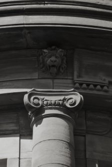 Detail of Ionic capital and lions head mask