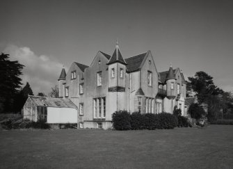 View from South West showing main house and conservatory.