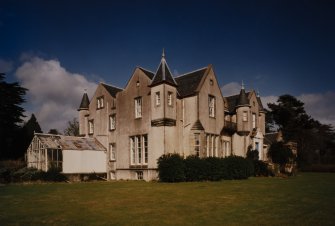 View from South West showing main house and conservatory.