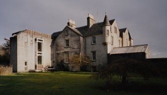 View from West showing facade of original 18th century house with kitchen wing.