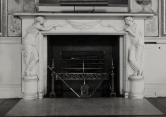 Inveraray Castle, interior.
View of the fireplace. White marble with two Classical maidens holding a swag attached to a central urn.