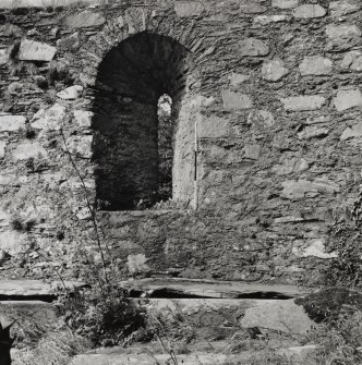 Detail of arched window and outside wall.