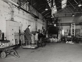 Glasgow, Springburn, St Rollox Locomotive Works, interior.
View from North of heat treatment furnace in Blacksmith's shop.