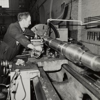 Glasgow, Springburn, St Rollox Locomotive Works, interior.
View of carriage axle turning lathe in operation.