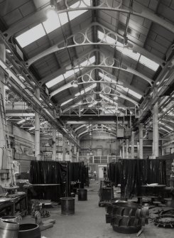 Glasgow, 191-197 Scotland Street, Howden's Works, interior.
General view from East showing bay 7 - one of six bays in the centre of the factory with ornate steel roof trusses. The 'I' section steel uprights are 0.30m across and 0.17m wide.