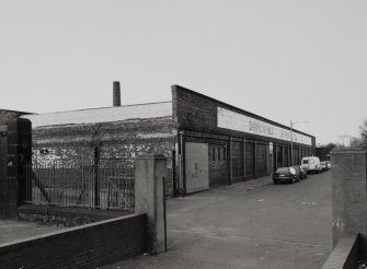 49 Solway Street, Barrowfield Works
General view of remains of works from South East, showing chimney stack in background