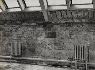 Interior.
View of exposed rubble on W wall.