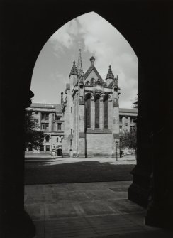 View of chapel through cloisters to East South East.