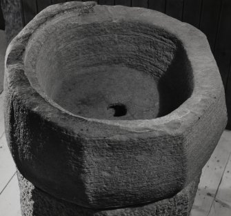 View of the medieval font taken from the church of St Cathan, now held in Gigha Parish Church