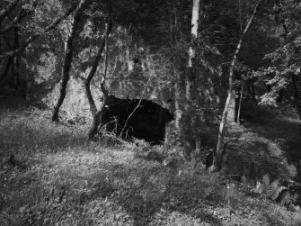 Furnace, Loch Fyne Powder Works.
View of arch (through which lade passed) in South end of incorporating mills from South.