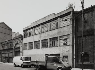 View from E showing number 21 Walls Street with cheese market in background