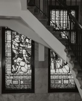 Interior.
View of stained glass window lighting main staircase.