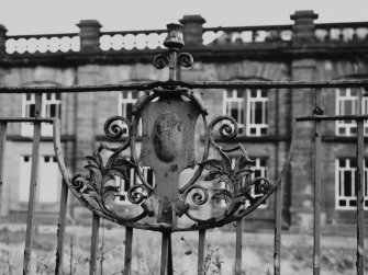 Detail of decorative iron work on railings outside main frontage.