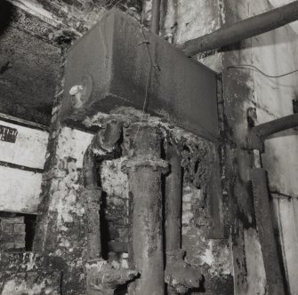 Detail of tank supported on ornate cast-iron bracket on the outside wall at the NE corner of the Still House