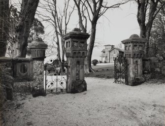 View from SE showing gate-piers and house.