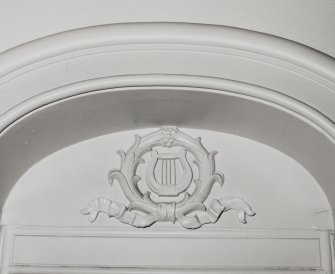 Interior.  Detail of decorative feature above ground floor door.