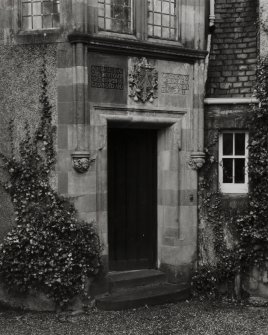 View of porch.
Inscription above the door reads: 'A house that God doth oversee, is grounded and watched as well as can be, Salve Bene Dicite'