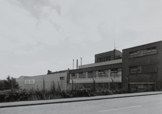 General view from NW (in Lynedoch Street) of N block of factory, showing Filling, Packing and Despatch Departments (building no. 30, NS2786 7547), and Warehouse 1 (buildings 32, NS2791 7547 and 33, NS 2794 7545)