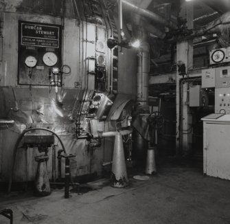 Interior view of front of No.2 Fine Sugar Pan (1 of 4) in the Crystallisation Building.  In a similar way to the Recover Pans, the Fine Pans produced product sugars from re-crystallising the now purified main process stream from the Resin Cells.  Operating under vacuum, the pans boiled at lower temperatures, thus reducing the formation of colour (T&L No.: 21175/7)