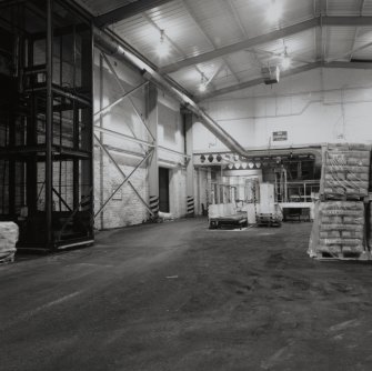 Interior view of the Warehouse, with the 25kg and 50kg bag ISV Palletiser in the background (T&L No.: 21185/3)