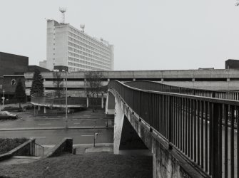 View from pedestrian bridge towards Plaza Tower and car park