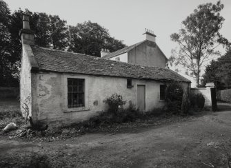 View of house and outbuildings from E.